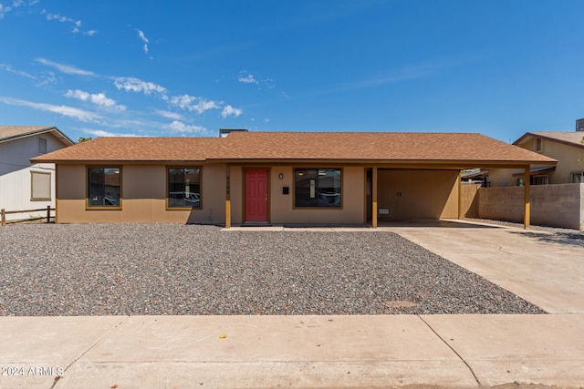 ranch-style home with a carport