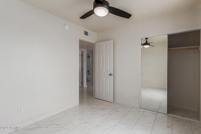 8508 W Clarendon Ave W, Phoenix, AZ 85037 - unfurnished bedroom with baseboards, visible vents, marble finish floor, and a closet
