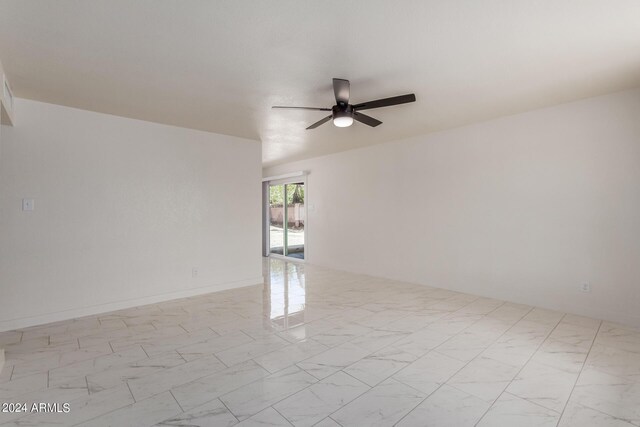 8508 W Clarendon Ave W, Phoenix, AZ 85037 - empty room featuring a ceiling fan and marble finish floor