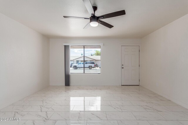 8508 W Clarendon Ave W, Phoenix, AZ 85037 - unfurnished room featuring marble finish floor and ceiling fan