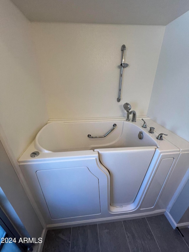 bathroom featuring a tub