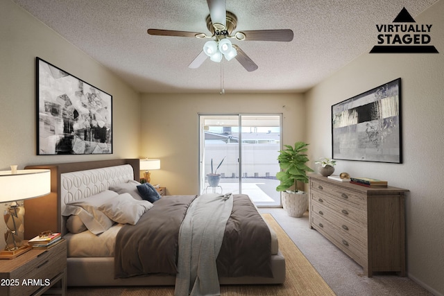 bedroom with access to exterior, ceiling fan, a textured ceiling, and light carpet