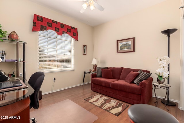 home office featuring baseboards, wood finished floors, and ceiling fan