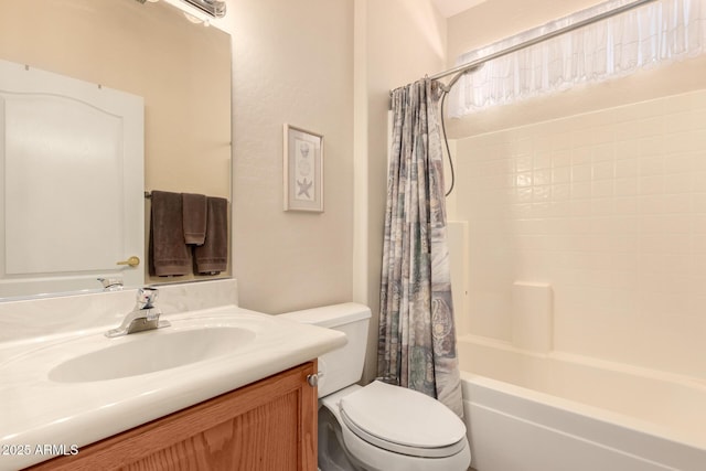 bathroom featuring toilet, shower / bath combo, and vanity