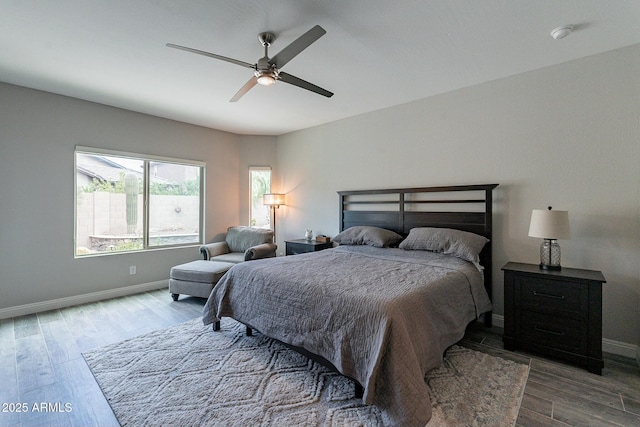 bedroom featuring hardwood / wood-style floors and ceiling fan