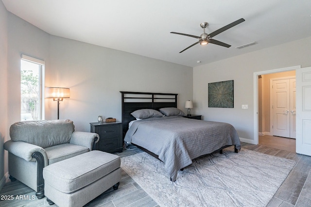 bedroom featuring light hardwood / wood-style flooring and ceiling fan