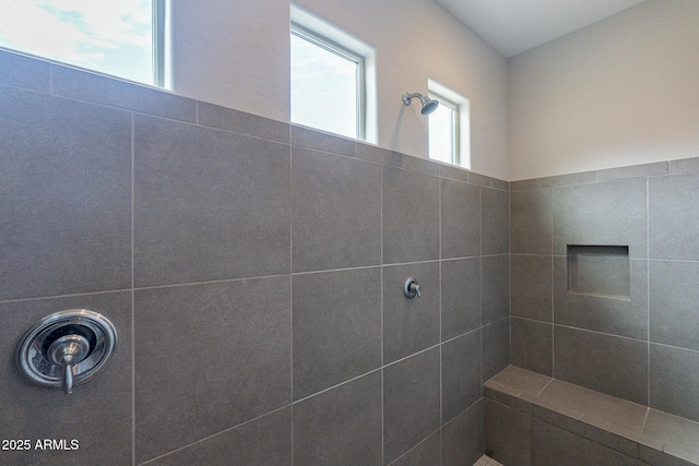 bathroom featuring tiled shower