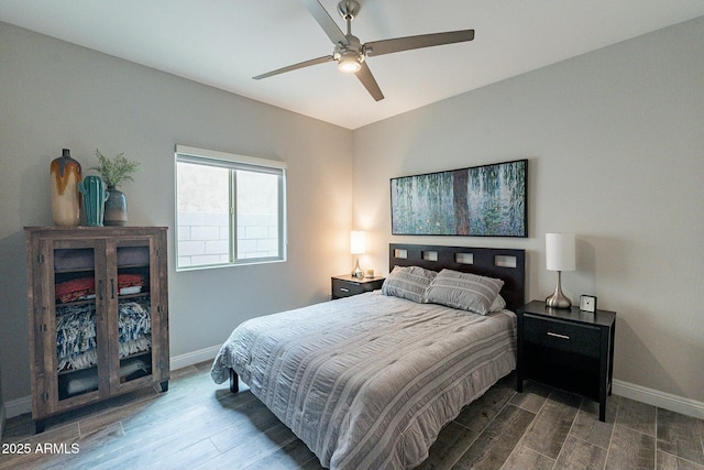 bedroom with hardwood / wood-style flooring and ceiling fan