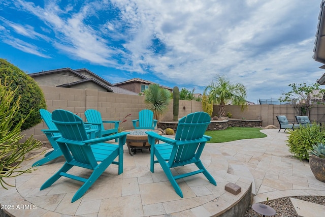 view of patio featuring a fire pit