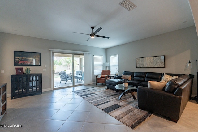 tiled living room with ceiling fan