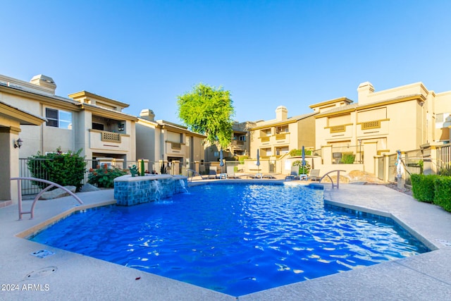 view of pool with pool water feature