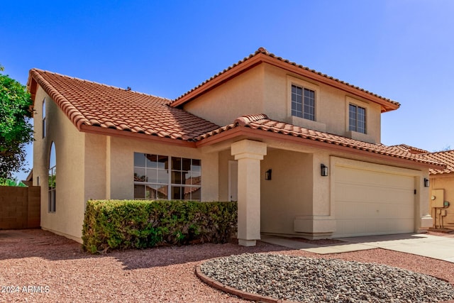 mediterranean / spanish-style house featuring a garage