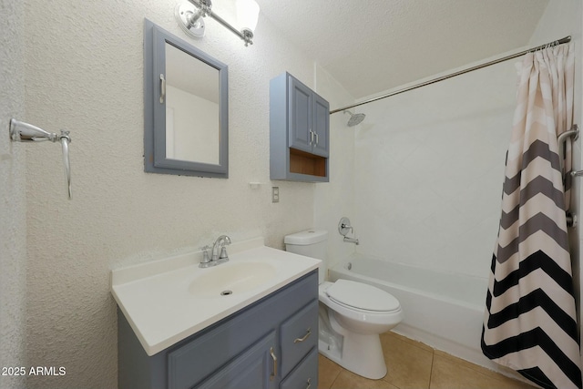 full bathroom featuring toilet, a textured wall, tile patterned floors, shower / bath combination with curtain, and vanity