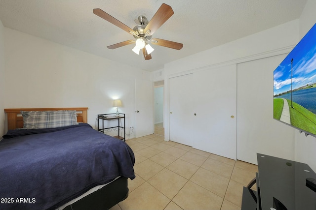 bedroom featuring light tile patterned flooring and ceiling fan