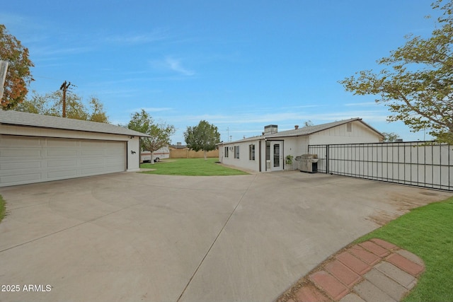 exterior space with a lawn and fence