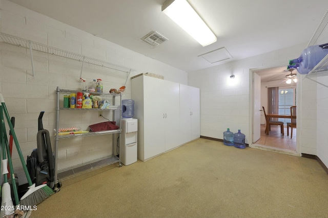 basement featuring visible vents and concrete block wall