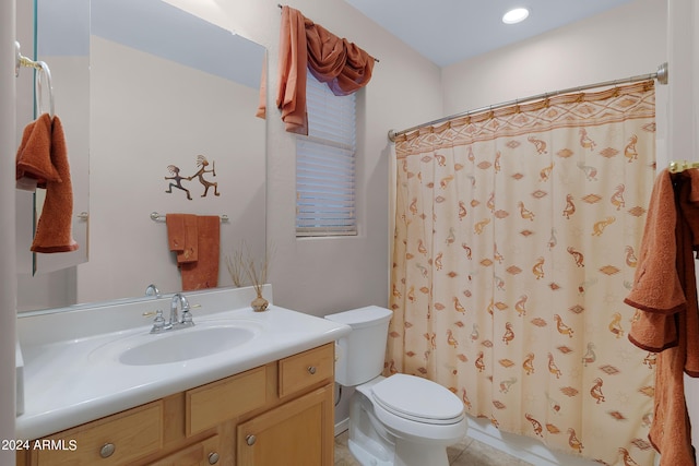 bathroom with toilet, a shower with shower curtain, and vanity