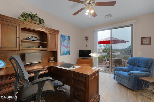 office space with a ceiling fan, visible vents, and light wood-style floors