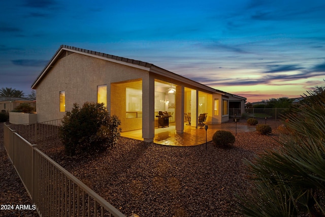 exterior space featuring a fenced backyard, a patio, and stucco siding