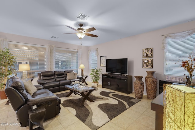 living room featuring ceiling fan, light tile patterned flooring, and visible vents