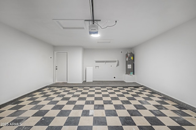 garage featuring electric water heater and a garage door opener