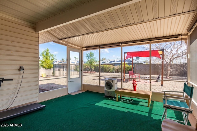 unfurnished sunroom with ac unit