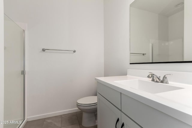 bathroom with toilet, tile patterned flooring, walk in shower, and vanity