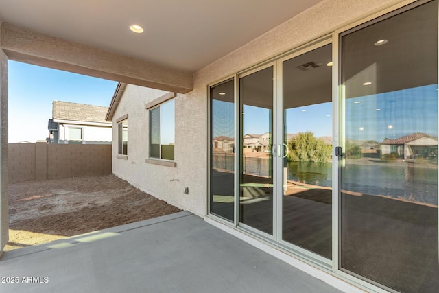 view of patio featuring a water view