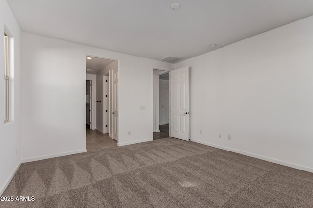 unfurnished bedroom with carpet floors