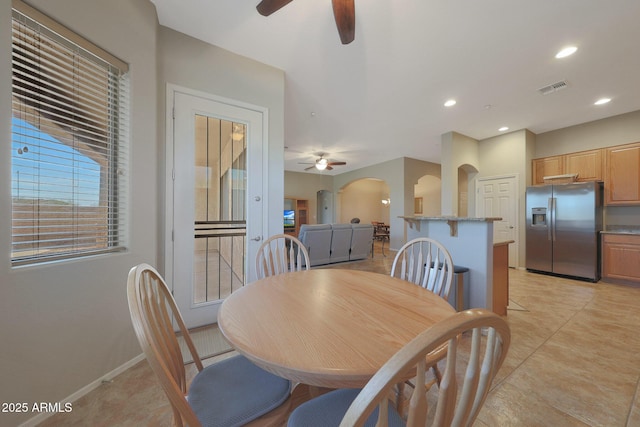 dining space with ceiling fan