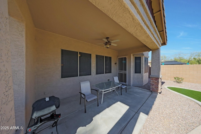 view of patio featuring ceiling fan