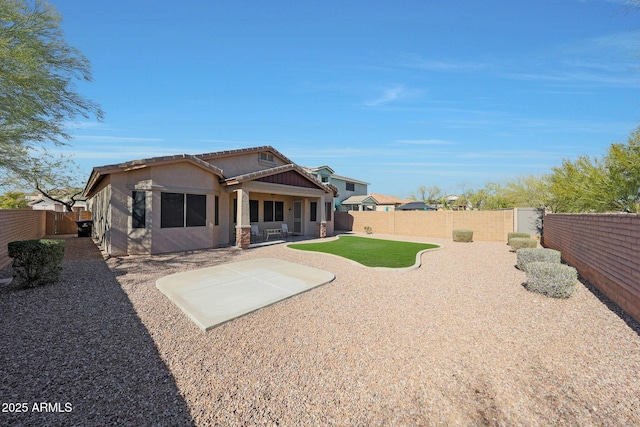 back of property featuring a patio area