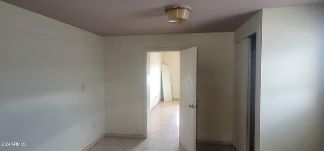 hallway with light tile floors