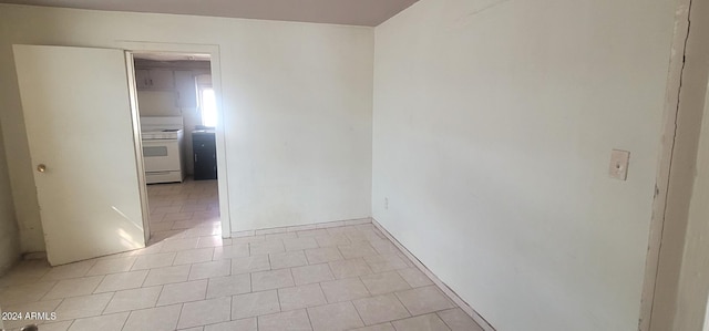 unfurnished room featuring light tile floors