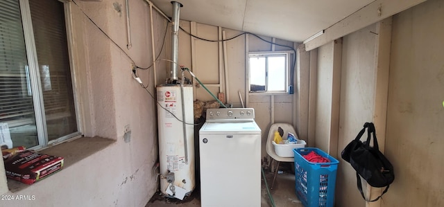 laundry area featuring gas water heater and washer / dryer