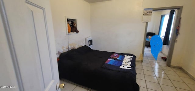 bedroom featuring light tile floors