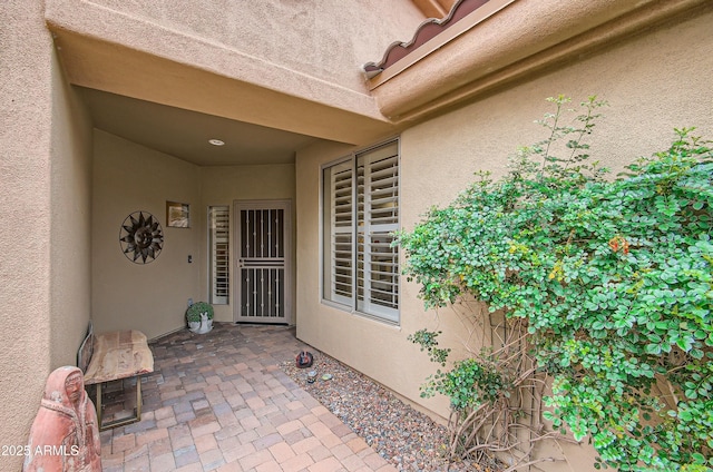 doorway to property featuring a patio