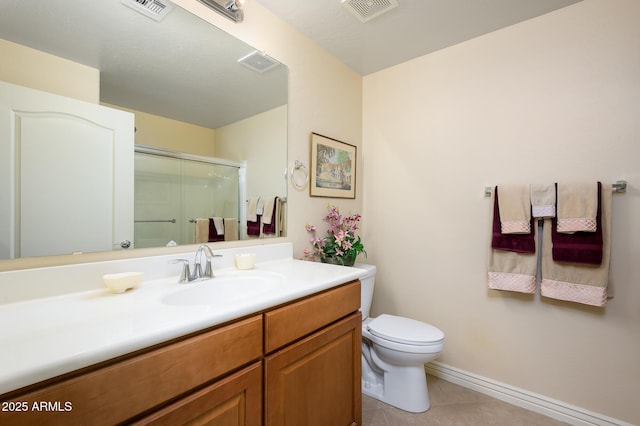 bathroom with toilet, tile patterned flooring, walk in shower, and vanity