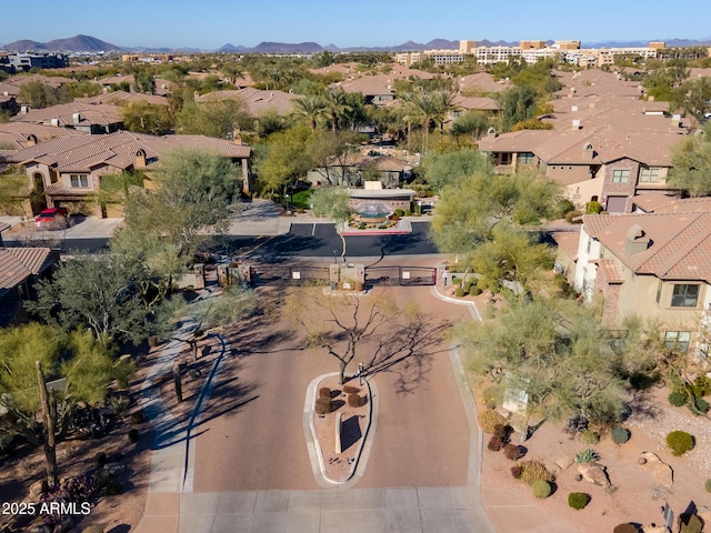 birds eye view of property with a mountain view