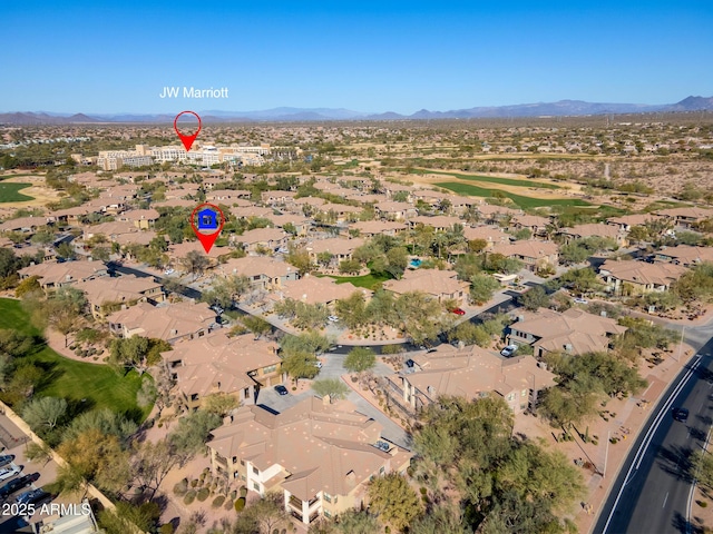 birds eye view of property with a mountain view