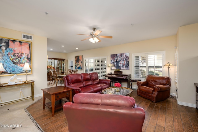 living room with hardwood / wood-style flooring and ceiling fan