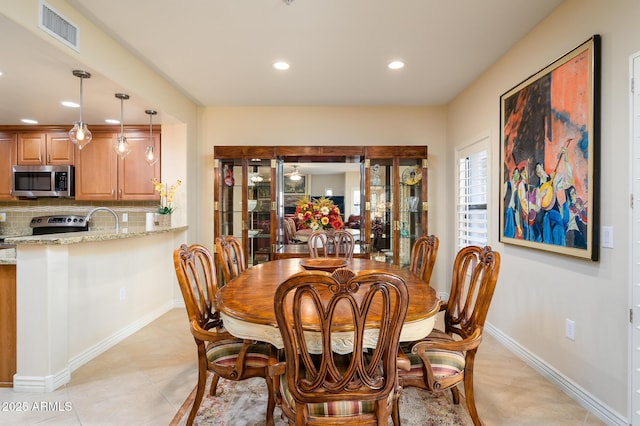 dining room featuring light tile patterned flooring