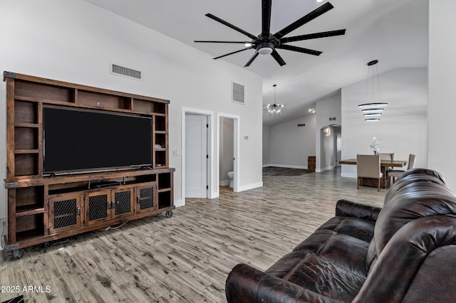 8913 S Forest Ave, Tempe, AZ 85284 - living area featuring ceiling fan, wood finished floors, high vaulted ceiling, and baseboards