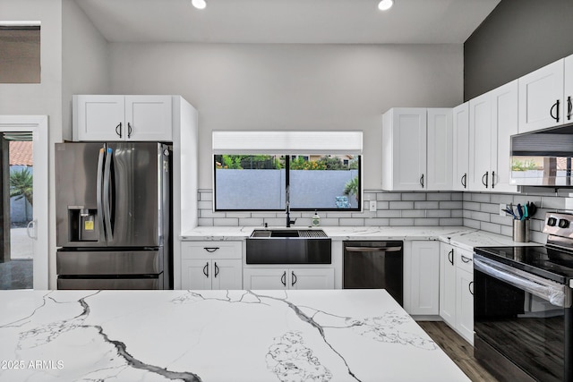 8913 S Forest Ave, Tempe, AZ 85284 - kitchen featuring stainless steel appliances, a sink, backsplash, light stone countertops, and recessed lighting