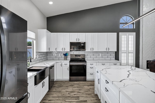 8913 S Forest Ave, Tempe, AZ 85284 - kitchen featuring appliances with stainless steel finishes, a towering ceiling, plenty of natural light, tasteful backsplash, and recessed lighting