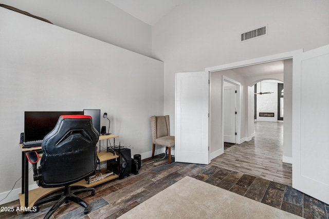 8913 S Forest Ave, Tempe, AZ 85284 - home office featuring high vaulted ceiling, wood finished floors, arched walkways, and baseboards