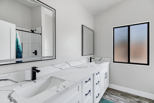 8913 S Forest Ave, Tempe, AZ 85284 - bathroom featuring plenty of natural light, double vanity, tiled shower, and baseboards