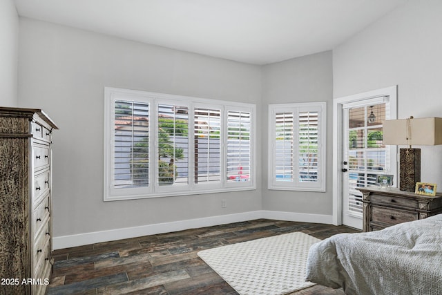 8913 S Forest Ave, Tempe, AZ 85284 - bedroom with baseboards, dark wood-type flooring, and access to outside