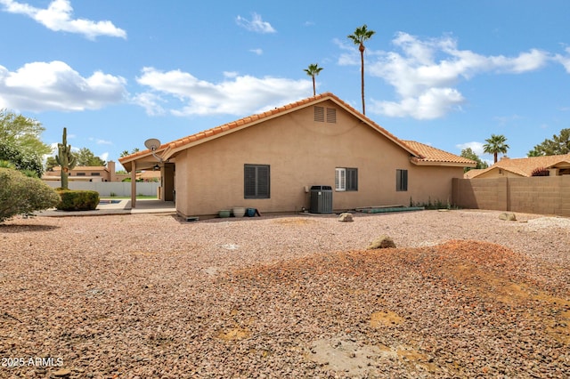 8913 S Forest Ave, Tempe, AZ 85284 - back of house with stucco siding, a fenced backyard, a patio area, and a tiled roof