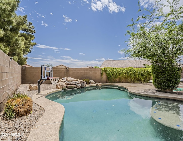 view of swimming pool featuring a fenced backyard and a fenced in pool
